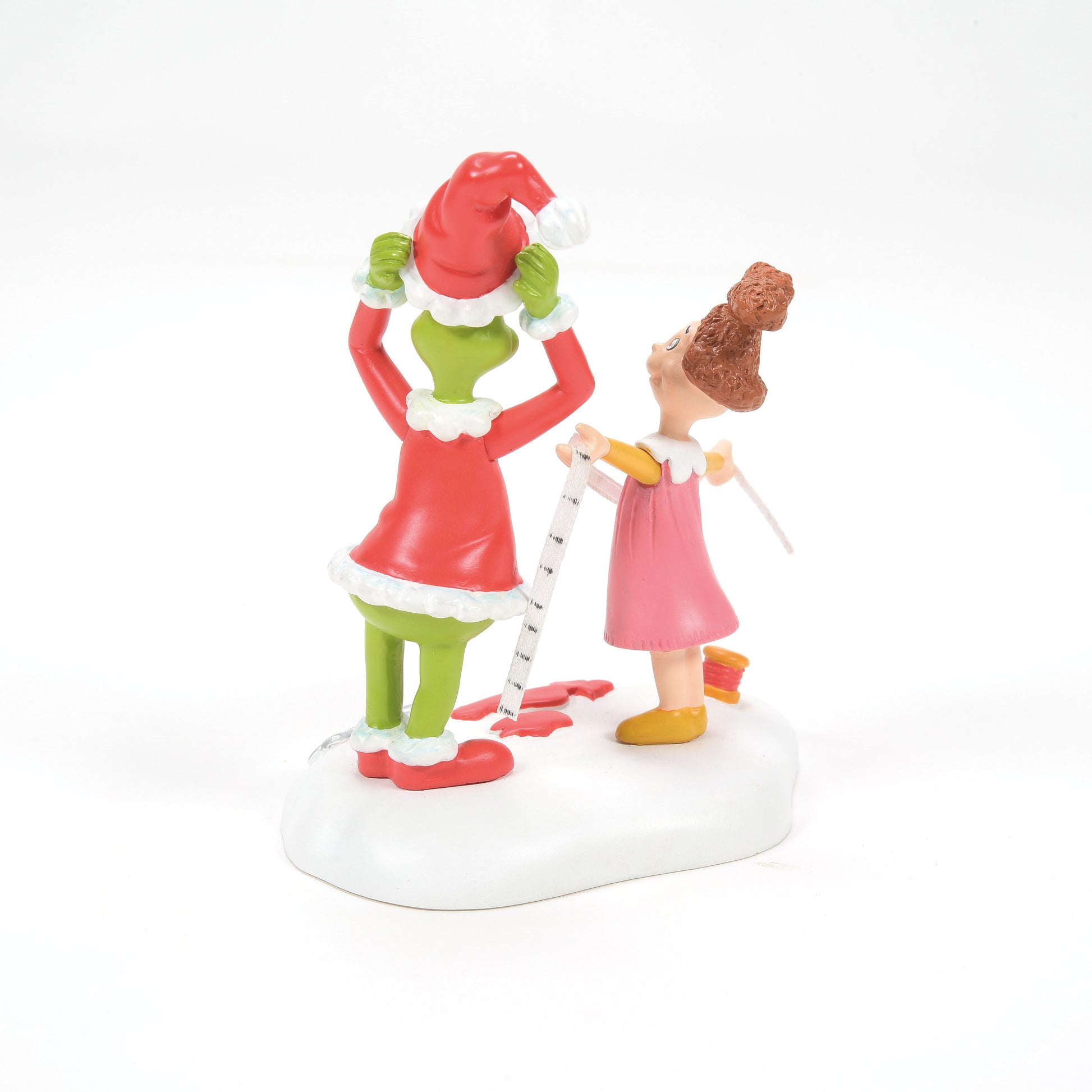 Grinch Village Being Fitted for a Santy Suit