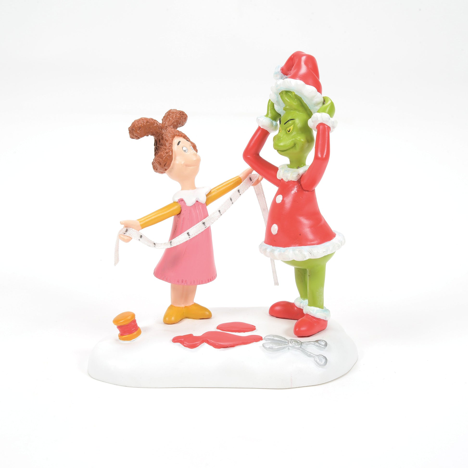 Grinch Village Being Fitted for a Santy Suit