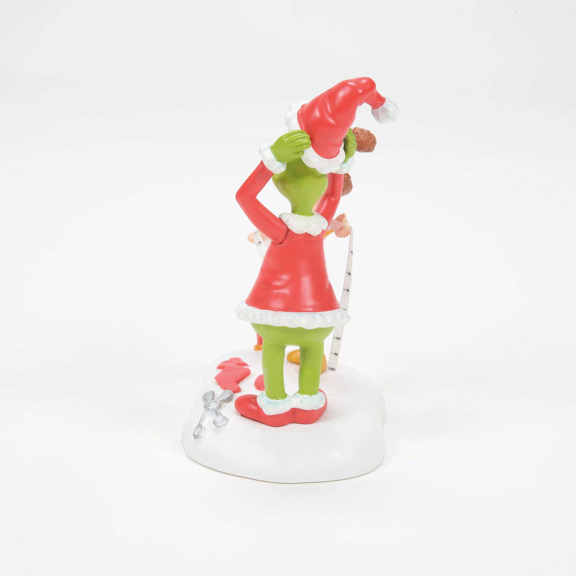 Grinch Village Being Fitted for a Santy Suit