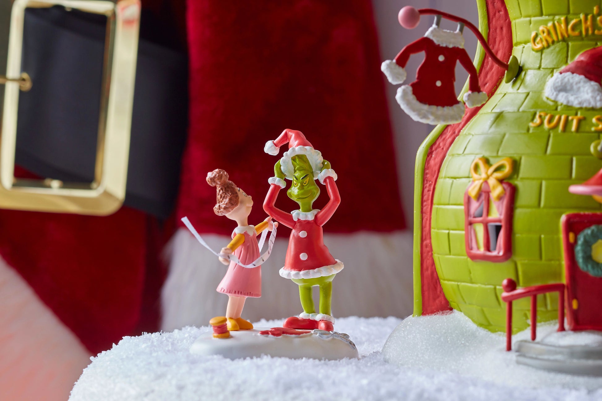 Grinch Village Being Fitted for a Santy Suit