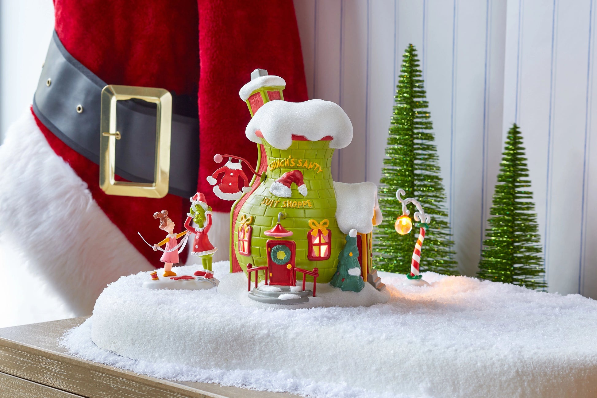 Grinch Village Being Fitted for a Santy Suit